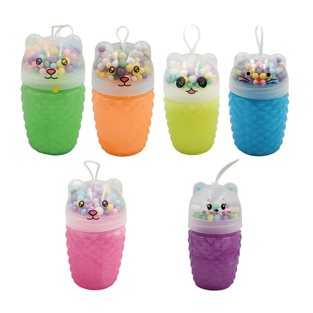 Bote de slime brilloso con rombos y tapa de animalito + bolitas de colores